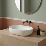 Lavabo da appoggio ovale in ceramica bianca 58x41 con bordo sottile